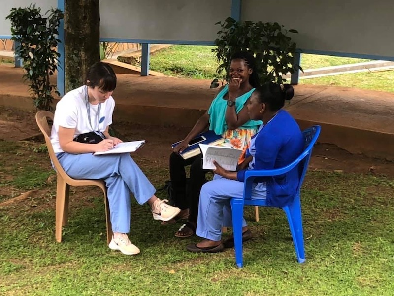 April Benak assessing two women in Uganda
