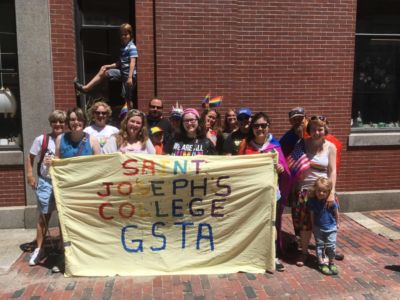 Students hold GSTA+ banner