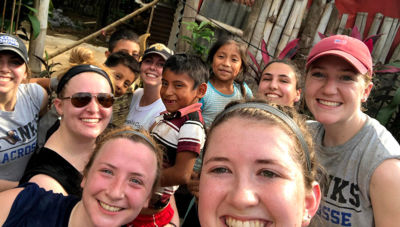 SJC students on Guatemalan service trip with local children