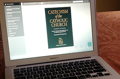 Catechism for Catholic Church content on a laptop screen