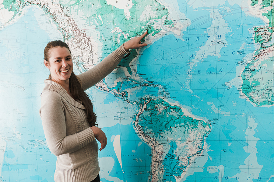 Education student pointing to an area on a map