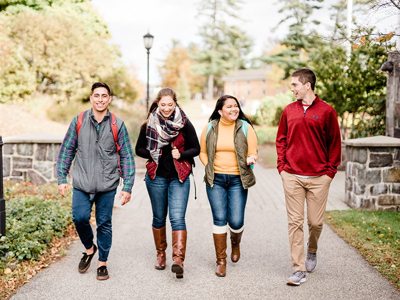 Students walk across campus in fall