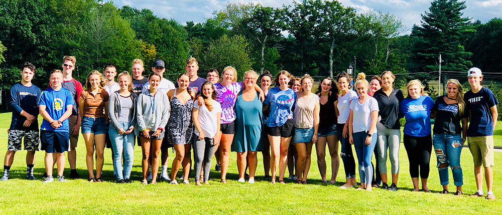 Group photo of the First Year Experience (FYE) Seminar students outside on the lawn with Dr. Marion Young.