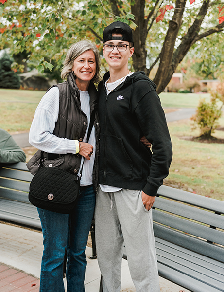 Mother and son on campus in fall